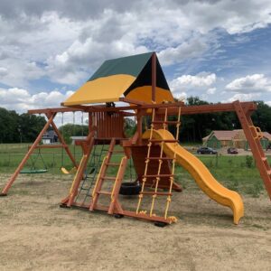 Cedar wood playset with green and yellow tarp and large level dry feet