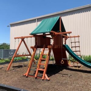 Cedar wood playset with green tarp and large level dry feet